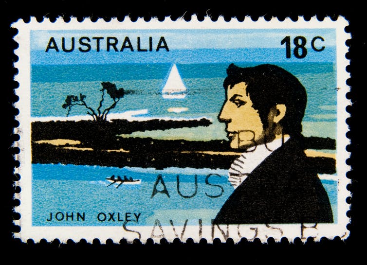 An old stamp showing Captain Cook and the ocean with some land.