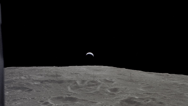 A crest of the Earth is visible above the surface of the Moon