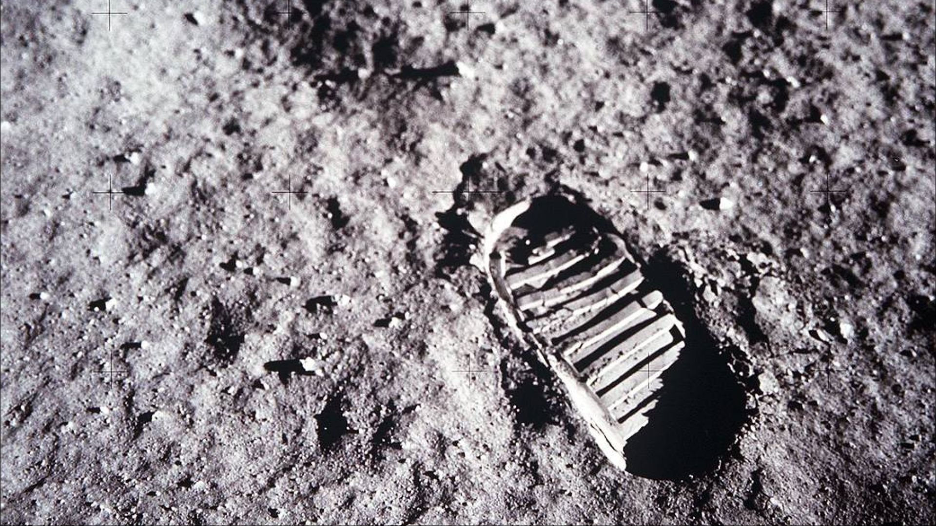 A close up of a bootprint on the Moon