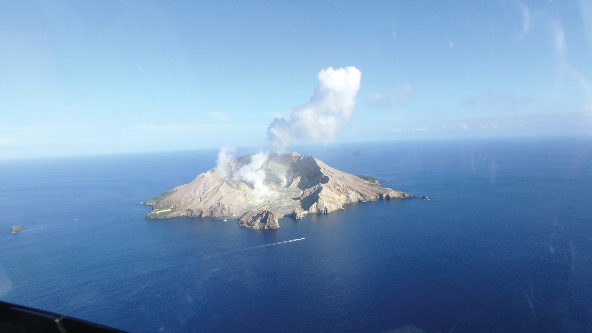 White Island volcano emitting white smoke