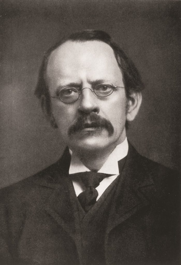Photograph of JJ Thomson who theorised that atoms were a region of positive charge surrounded by negative charges