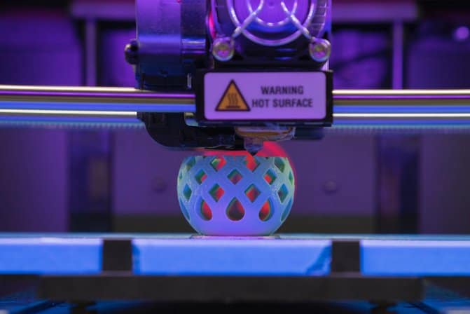 A 3D printer printing a hollow sphere shape